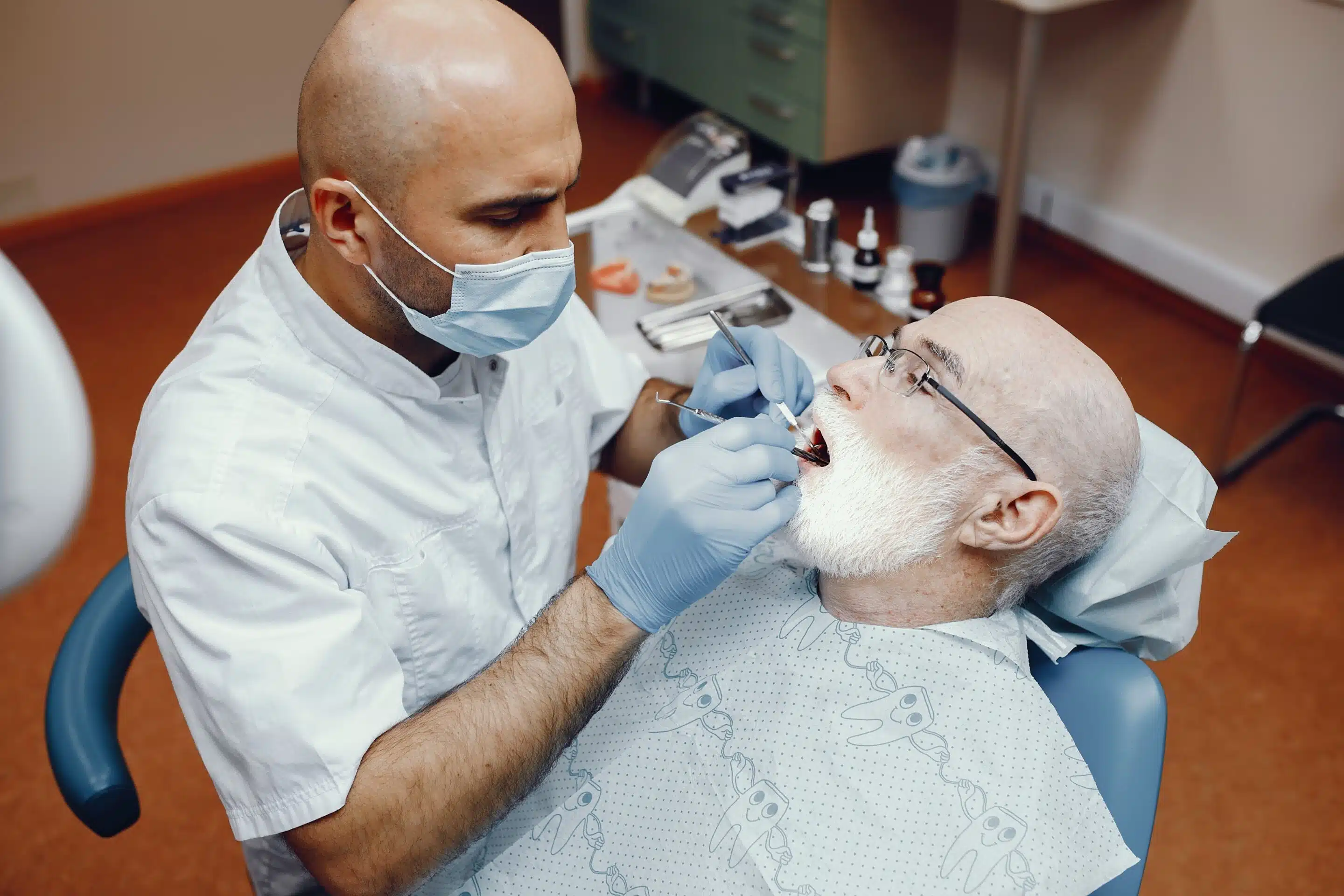 old-man-sitting-dentist-s-office (1) Implant Dentist in Houston TX